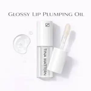 Tina Mattern Glossy Lip Plumping Oil hero image showing a clear lip oil tube with white cap and applicator on white background