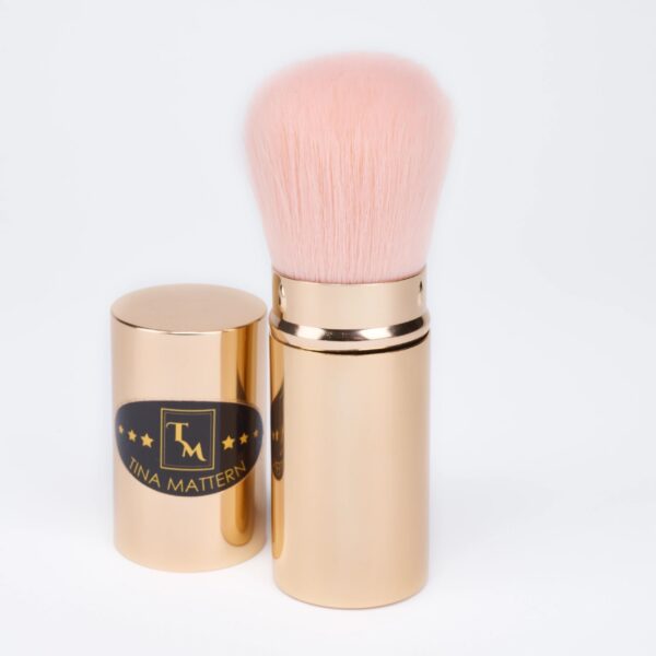 Tina Mattern Retractable Brush with soft, cruelty-free synthetic fibers for flawless application of blush, highlighter, and powder. Retractable design for travel convenience.