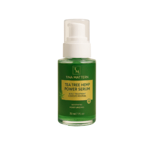 Tina Mattern Tea Tree Hemp Power Serum with a pump dispenser and green label featuring the product name and details.