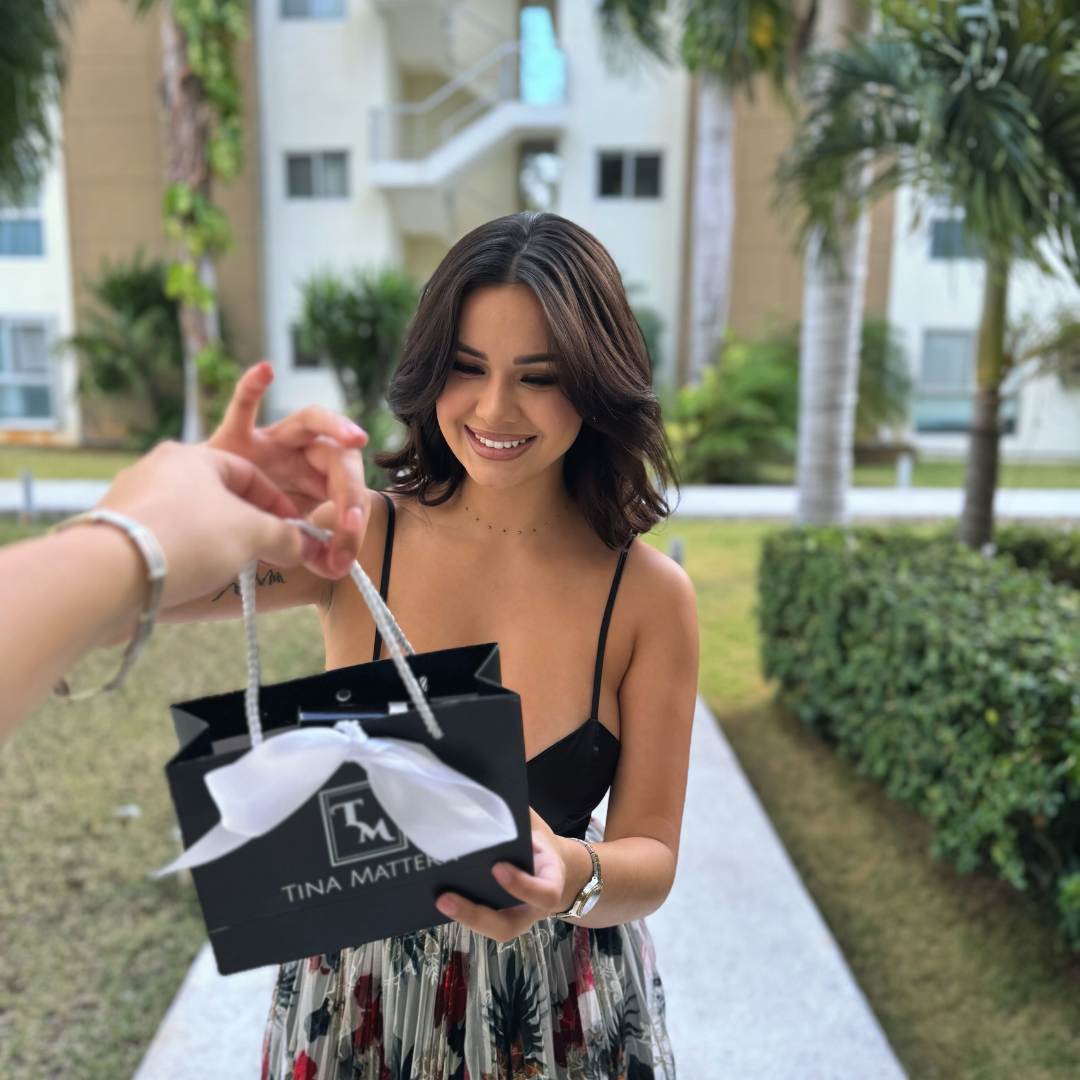 Tati holding gift web photo